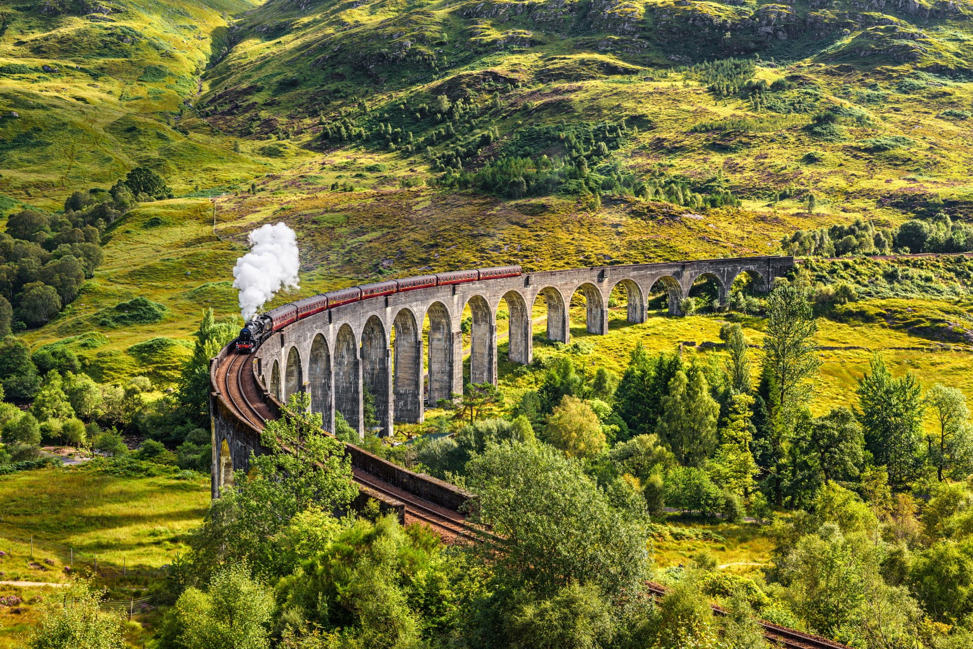 Scotland - Glenfinnan Railway Viaduct Glenfinnan Railway Viaduct in Scotland with the Jacobite steam train passing over